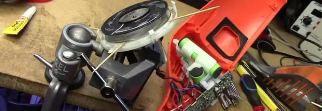 Vacuum cleaner repair parts and tools on a workbench in Newark, NJ